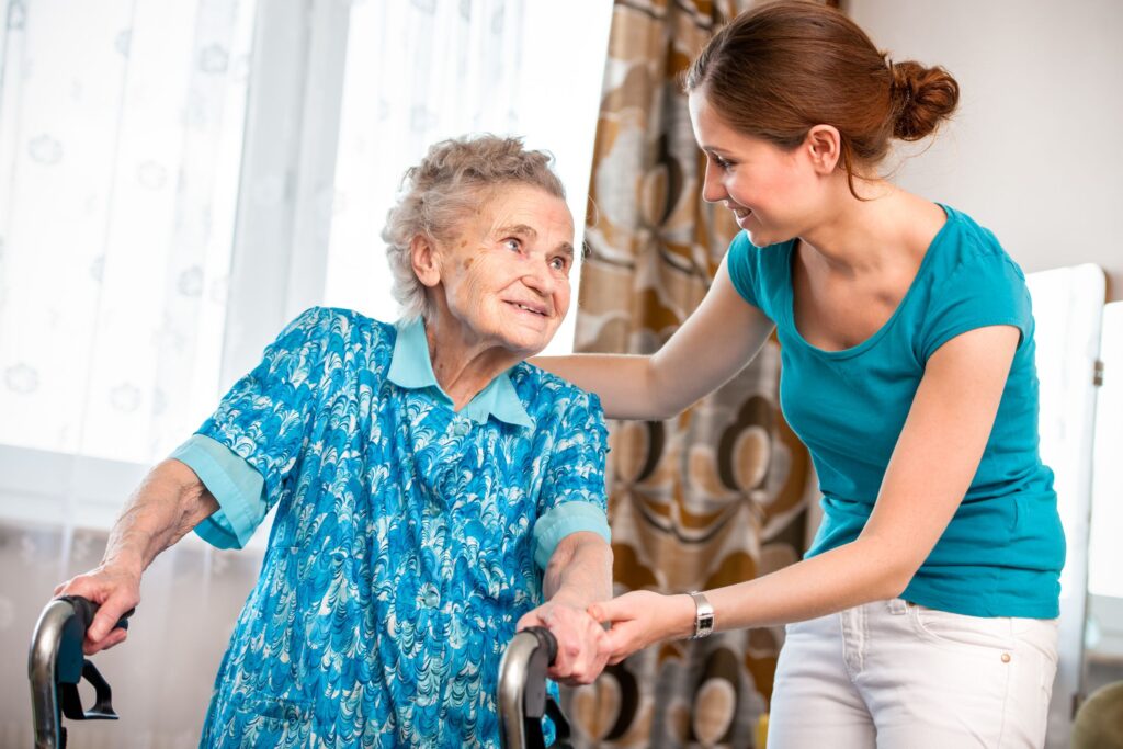 Physiotherapist guiding elderly woman