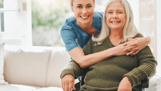 Woman giving an affectionate hug to older lady.