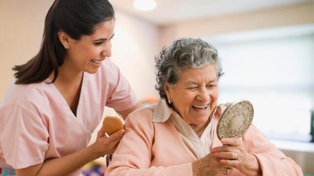 Family member supporting senior in living room.
